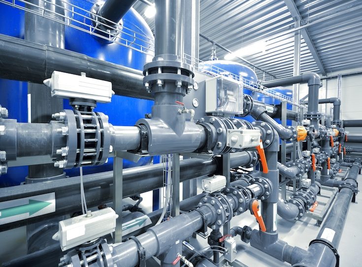 new plastic pipes and colorful equipment in industrial boiler room